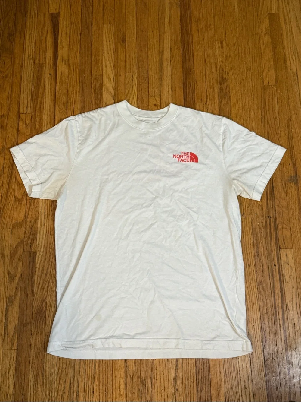 The North Face White Short Sleeve Tee with Red Logo. Size Large